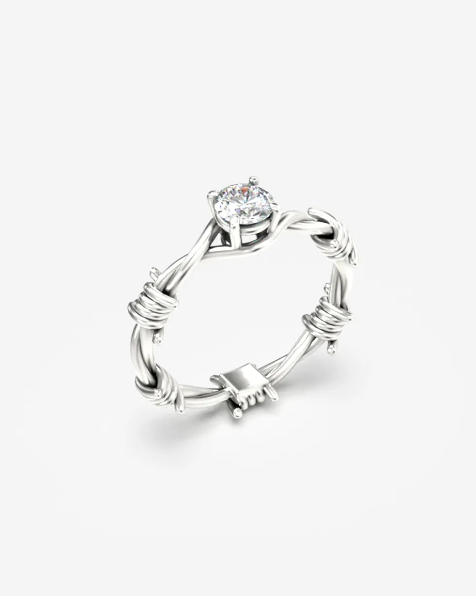 ANELLO SOLITARIO FILO SPINATO ARGENTO CON DIAMANTE
