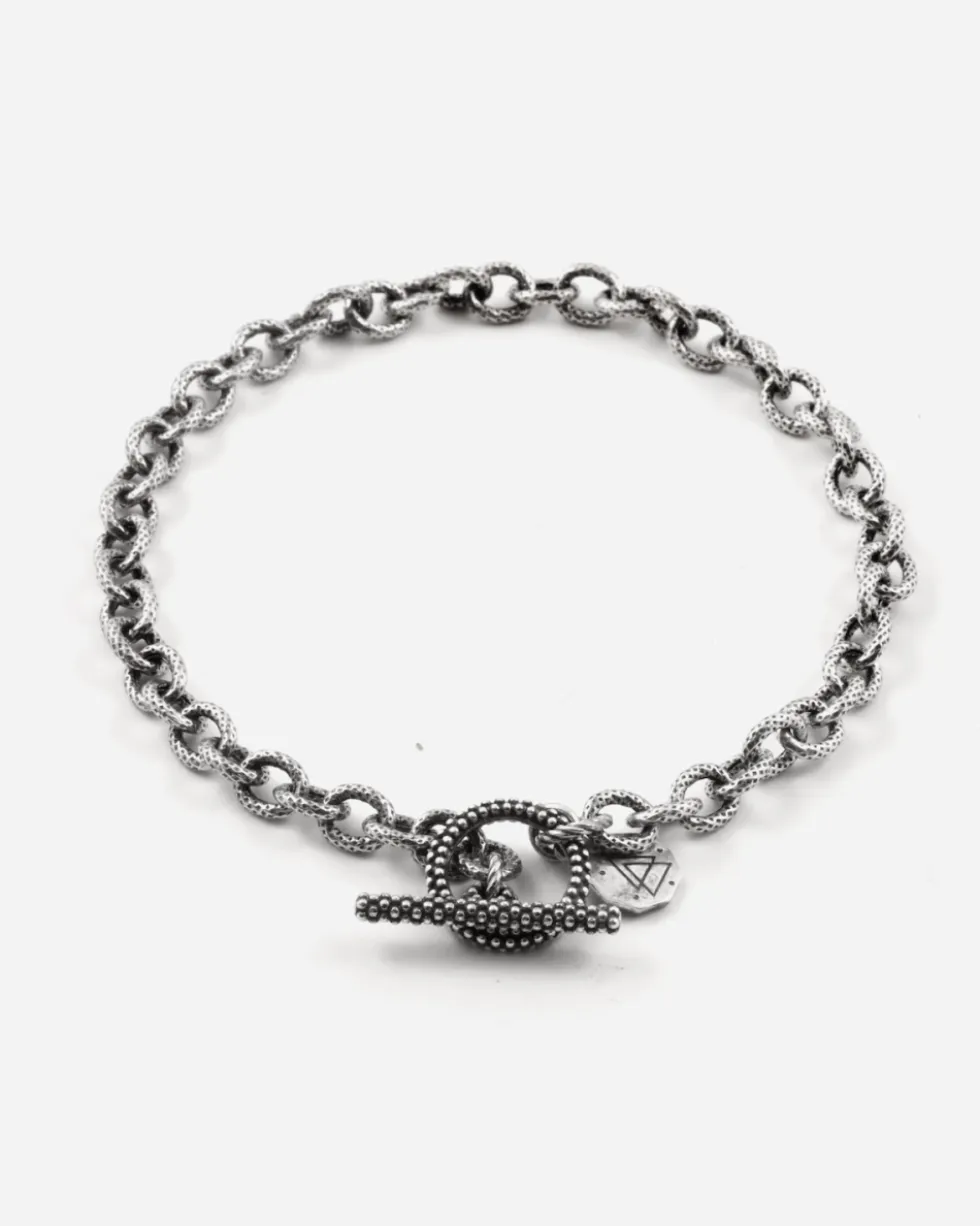 BRACCIALE CATENA RIGATA CON T-BAR PUNTINATA IN ARGENTO