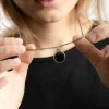 CIONDOLO TONDO PUNTINATO CON PIETRA ONICE